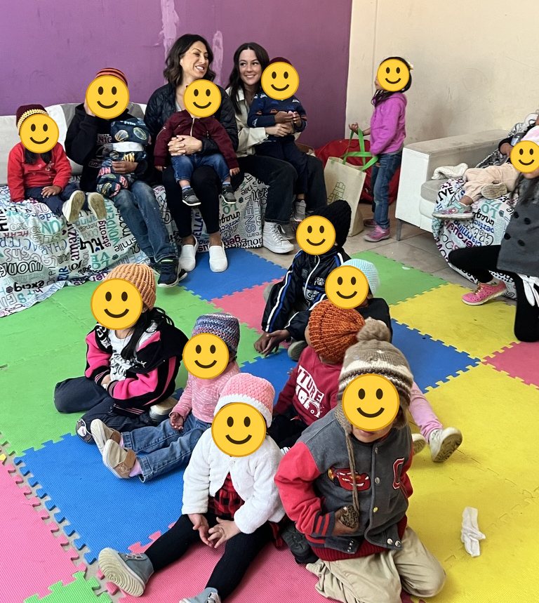 Children and volunteers in the playroom at Hogar Luz de María